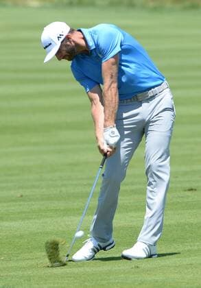 Dustin Johnson hits his second shot to the 18th hole of his first round during the Friday round of the U.S. Open golf championship at Oakmont Country Club near Pittsburgh, Pennsylvania on June 17, 2016. Johnson finished at three under par, one back after the first round, which was delayed because of rain yesterday. Johnson will play his second round later in the day.  OAK20160617121 PATxBENIC