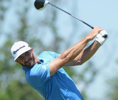 Dustin Johnson hits his drive on the 18th hole of his first round during the Friday round of the U.S. Open golf championship at Oakmont Country Club near Pittsburgh, Pennsylvania on June 17, 2016. Johnson finished at three under par, one back after the first round, which was delayed because of rain yesterday. Johnson will play his second round later in the day.  OAK20160617125 PATxBENIC