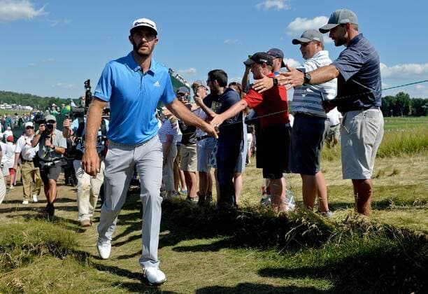 Dustin Johnson greets fans as he walks to the 14th green during the U.S. Open at Oakmont Country Club in Oakmont, Pennsylvania on June 17, 2016.  OAK20160617331 KEVINxDIETSCH