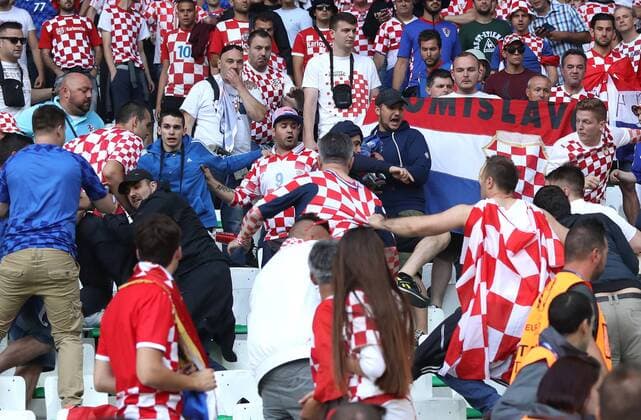 EURO 2016 - Croatia fans throw flares onto pitch 17.06.2016., Stadium Geoffroy-Guichard, Saint-Etienne, France - UEFA EURO EM Europameisterschaft Fussball 2016, Round 2, Group D, Czech Republic - Croatia. Croatia supporters fight among themselves after they throw flares on the pitch.  SanjinxStrukic PIXSELL