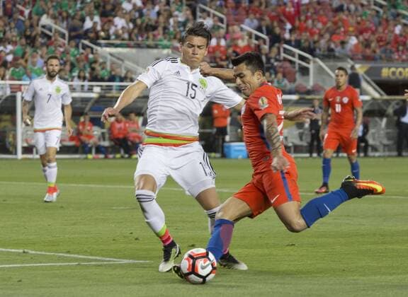 Copa America, Viertelfinale, Mexiko - Chile 0:7 June 18, 2016 - Santa Clara, California, U.S - Edson Puch 22 of Chile takes a shot into goal as Hector Moreno 15 of Mexico defends in their quarterfinal match in the Copa America Centenario 2016 football tournament held at Levis Stadium in Santa Clara, California on Saturday June 18, 2016. Chile defeats Mexico 7-0. Mexico vs. Chile - ZUMAp124