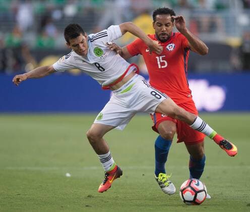 Jean Beausejour (R) of Chile vies with Hirving Lozano of Mexico during their quarterfinal match of 2016 Copa America soccer tournament at the Levi s Stadium in Santa Clara, California, the United States, June 18, 2016. Chile won 7-0. Yang Lei)(wll) (SP)US-SANTA CLARA-SOCCER-COPA AMERICA-QUARTERFINAL-MEX VS CHI YangxLeixC 