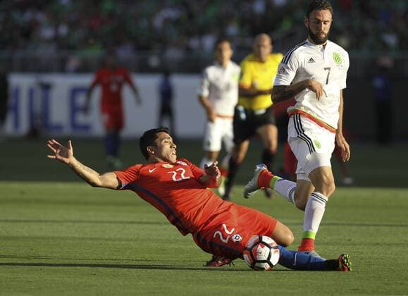June 18, 2016 - Los Angeles, California, U.S - Chile forward Edson Puch 22 slides to the ball against Mexico defender Miguel Layun 7 in the Copa America soccer match between Mexico and Chile at the LeviÃ s Stadium in Santa Clara, California, June 18, 2016. Chile won 7-0. Copa America 2016 Quarterfinal Chile defeats Mexico 7-0 - ZUMAc68_