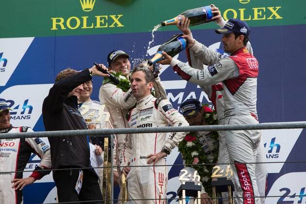 19.06.2016. Le Mans Circuit, Le Mans, France. Le Mans 24 Hours Race. Porsche Team driver Romain Dumas gets soaked with champagne. xTimxWilliamsx  ActionPlus11751890