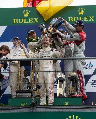19.06.2016. Le Mans Circuit, Le Mans, France. Le Mans 24 Hours Race. Porsche Team driver Romain Dumas gets soaked with champagne. xTimxWilliamsx  ActionPlus11751891