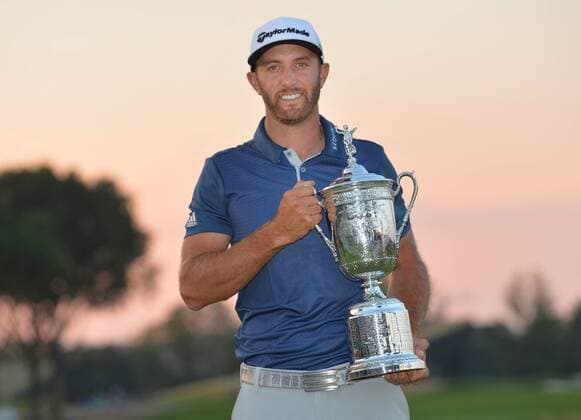 Dustin Johnson holds the Championship Trophy on the 18th green after winning his first major championship in the final round at the U.S. Open at Oakmont Country Club near Pittsburgh, Pennsylvania on June 19, 2016. Johnson won with a score of 5 under par.  OAK20160619720 KEVINxDIETSCH