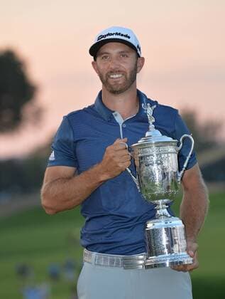 Dustin Johnson holds the Championship Trophy on the 18th green after winning his first major championship in the final round at the U.S. Open at Oakmont Country Club near Pittsburgh, Pennsylvania on June 19, 2016. Johnson won with a score of 5 under par.  OAK20160619721 KEVINxDIETSCH