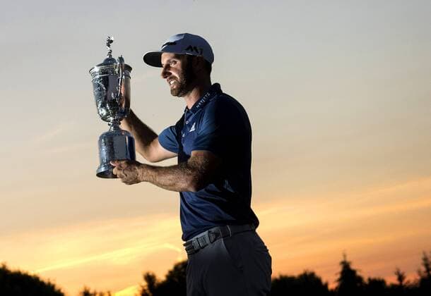 Dustin Johnson holds the Championship Trophy on the 18th green after winning his first major championship in the final round at the U.S. Open at Oakmont Country Club near Pittsburgh, Pennsylvania on June 19, 2016. Johnson won with a score of 5 under par.  OAK20160619750 KEVINxDIETSCH