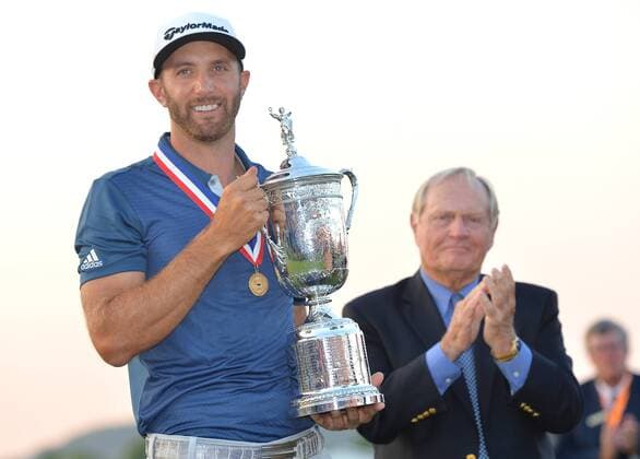 Golf Legend Jack Nicklaus applauds as Dustin Johnson holds the Championship Trophy on the 18th green after winning his first major championship in the final round at the U.S. Open at Oakmont Country Club near Pittsburgh, Pennsylvania on June 19, 2016. Johnson won with a score of 5 under par.  OAK20160619891 KEVINxDIETSCH