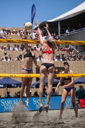 25 June 2016: Sara Hughes tries to get the ball past Kerri Walsh Jennings as teammate Kelly Claes looks on during the AVP San Francisco Open in San Francisco, CA. (Photo by Hailey Archambault Icon Sportswire) VOLLEYBALL: JUN 25 AVP San Francisco Open Icon160625326 EDITORIAL USE ONLY