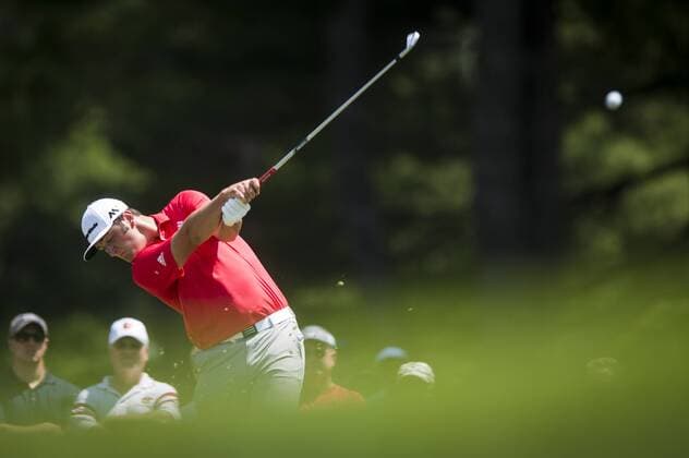 Spaniard Jon Rahm plays his tee shot on the 2nd hole at Congressional CC during the final round of the Quicken Loans National golf tournament in Bethesda, Maryland on Sunday, June 36, 2016. Billy Hurley III, of Annapolis Maryland, shot a 2-under 69 on Sunday for his first tournament win.  WAP201606260094 PETExMAROVICH