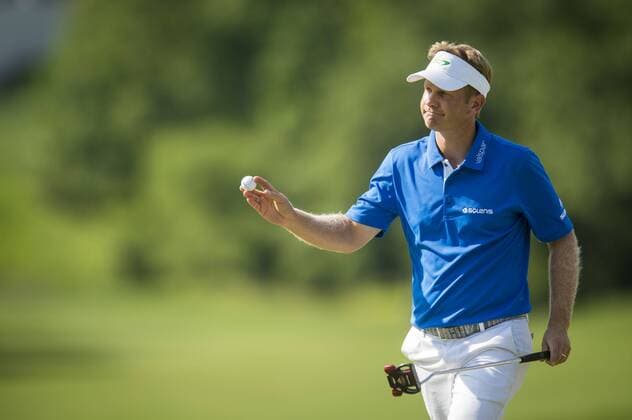 Billy Hurley III reacts after sinking a long putt for par on the 11th hole at the Quicken Loans National golf tournament at Congressional CC in Bethesda, Maryland on Sunday, June 36, 2016. Hurley, of Annapolis, Maryland, shot a 2-under 69 on Sunday for his first tournament win.  WAP201606260491 PETExMAROVICH