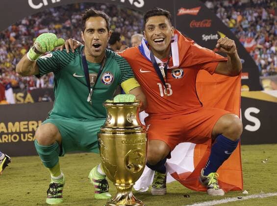 Claudio Bravo and Gonzalo Jara of Chile celebrate on the field after there team defeats Argentina at the Copa America Centenario USA 2016 Finals at MetLife Stadium in East Rutherford, New Jersey on June 26, 2016. Chile defeated Argentina 4-2 in penalty kicks and won there second consecutive Copa America.  NYP20160626109 JOHNxANGELILLO