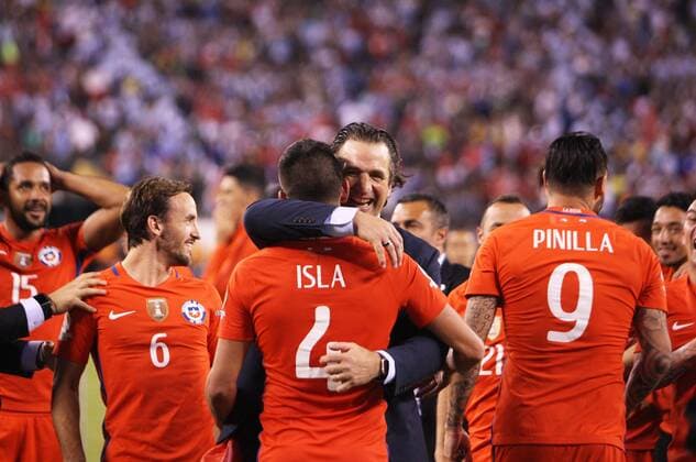 Juan Antonio Pizzi (R), head coach of Chile hugs with player Mauricio Isla to celebrate after winning the final of 2016 Copa America Centenario soccer tournament at the Metlife Stadium in New Jersey, the United States on June 26, 2016. Chile defeated Argentina with 4-2 in penalty shootout. )(wll) (SP)US-NEW JERSEY-SOCCER-COPA AMERICA CENTENARIO-FINAL QinxLang 