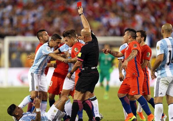 Referee Heber Lopes shows a red card to Marcos Rojo (Bottom) of Argentina during the 2016 Copa America Centenario soccer tournament Final at the Metlife Stadium in New Jersey, the United States on June 26, 2016. Chile defeated Argentina with 4-2 in penalty shootout. )(wll) (SP)US-NEW JERSEY-SOCCER-COPA AMERICA CENTENARIO-FINAL QinxLang 