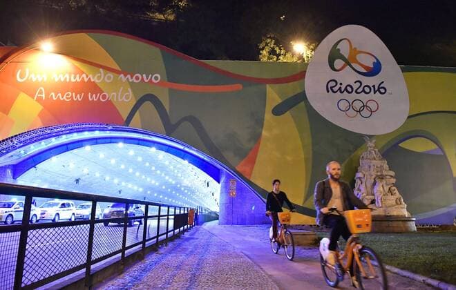 Tunnel entrance featuring Rio Olympic logo and slogan The logo and slogan of the Rio de Janeiro Olympic and Paralympic Games are featured at the entrance of a tunnel connecting the Rio de Janeiro city center and Copacabana beach on June 27, 2016, as the specially designed entrance was unveiled to the public the same day. 