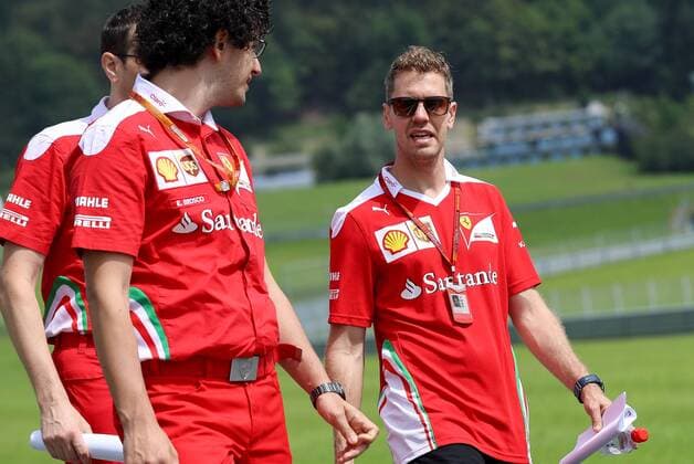 FORMULA 1 - GP of Austria 2016 SPIELBERG,AUSTRIA,30.JUN.16 - MOTORSPORTS, FORMULA 1 - Grand Prix of Austria, Red Bull Ring, preview. Image shows Sebastian Vettel (GER Scuderia Ferrari right) with team members. GEPAxpictures xChristianxWalgram