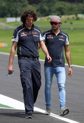 FORMULA 1 - GP of Austria 2016 SPIELBERG,AUSTRIA,30.JUN.16 - MOTORSPORTS, FORMULA 1 - Grand Prix of Austria, Red Bull Ring, preview. Image shows Carlos Sainz Jr. (ESP Scuderia Toro Rosso right) with a team member. GEPAxpictures xChristianxWalgram