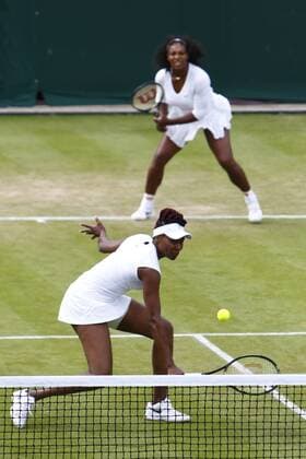 30.06.2016. All England Lawn Tennis and Croquet Club, London, England. The Wimbledon Tennis Championships Day Four. Serena Williams (USA) and Venus Williams (USA) doubles versus Andreja Klepac (SLO) and Katarina Srebotnik (SLO). Venus Williams volleys at the net as sister Serena looks on. xAlanxMartinx  ActionPlus11756635