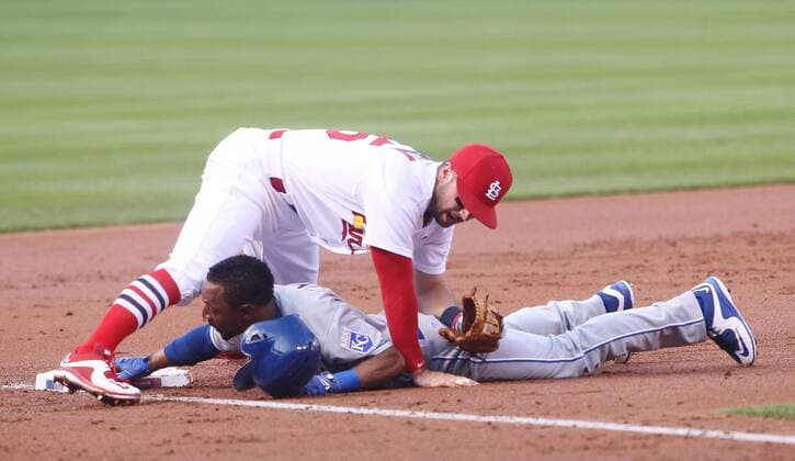 St. Louis Cardinals third baseman Greg Garcia falls over Kansas City Royals Jarrod Dyson after tagging him out in the second inning at Busch Stadium in St. Louis on June 30, 2016. Dyson was thrown out at third after a play that resulted in an error.  SLP2016063004 BILLxGREENBLATT