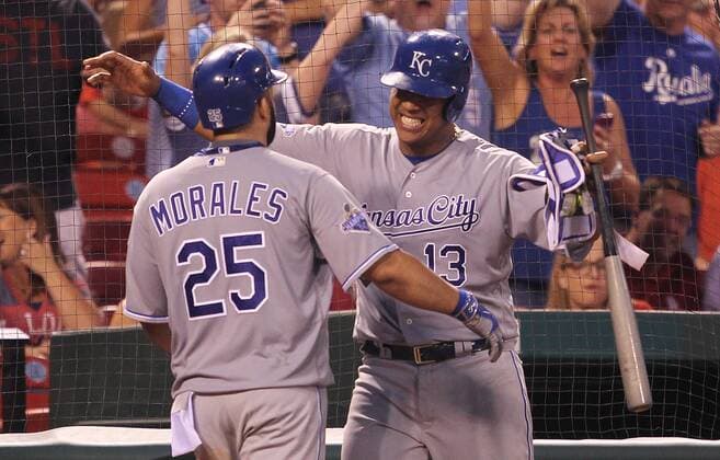 Kansas City Royals Kendrys Morales gets a hug from teammate Salvador Perez after hitting a solo home run against the St. Louis Cardinals in the eighth inning at Busch Stadium in St. Louis on June 30, 2016.  SLP2016063009 BILLxGREENBLATT