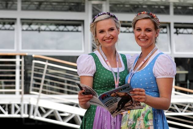 FORMULA 1 - GP of Austria 2016 SPIELBERG,AUSTRIA,01.JUL.16 - MOTORSPORTS, FORMULA 1 - Grand Prix of Austria, Red Bull Ring, free practice. Image shows the hostesses with The Red Bulletin. GEPAxpictures xMaticxKlansek
