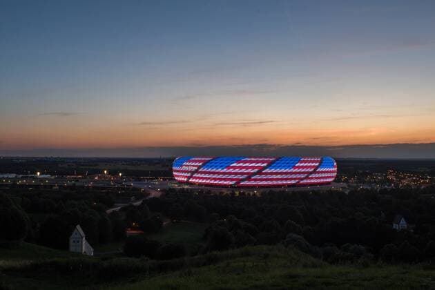 MUNICH, GERMANY - JULY 04: The Allianz Arena is illuminated with the flag of the United States of America to celebrate the Independance Day on July 4, 2016 in Munich, Germany.