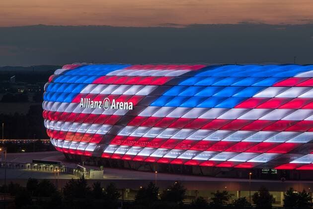 MUNICH, GERMANY - JULY 04: The Allianz Arena is illuminated with the flag of the United States of America to celebrate the Independance Day on July 4, 2016 in Munich, Germany.