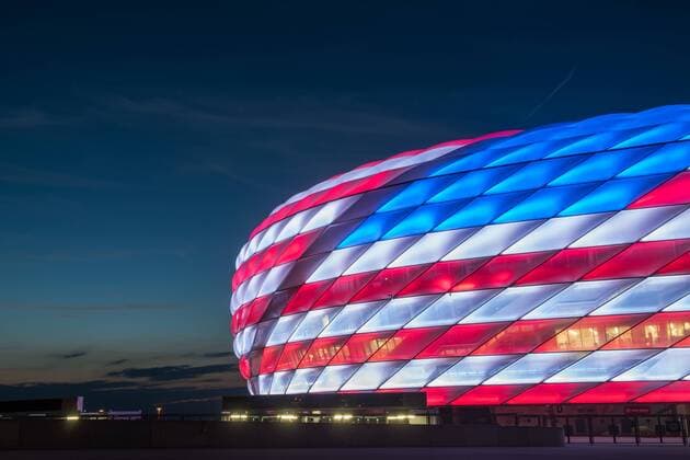 MUNICH, GERMANY - JULY 04: The Allianz Arena is illuminated with the flag of the United States of America to celebrate the Independance Day on July 4, 2016 in Munich, Germany.