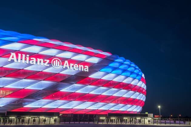 MUNICH, GERMANY - JULY 04: The Allianz Arena is illuminated with the flag of the United States of America to celebrate the Independance Day on July 4, 2016 in Munich, Germany.