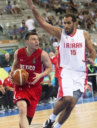 July 5, 2016 - Turin, Italy - The iranian power forward Hamed Hadadi defends against a drive to the basket by The mexican guard Francisco Cruz in the match between Mexico and Iran at 2016 FIBA Olympic Qualifying Tournament in Turin, Italy on July 5, 2016. FIBA Qualifying Tournament: Mexico v Iran  - ZUMAn230