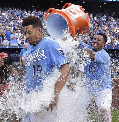 July 9, 2016 - Kansas City, MO, USA - The Kansas City Royals Cheslor Cuthbert gets the first of two Gatorade bucket showers from Salvador Perez after the team s 5-3 win against the Seattle Mariners on Saturday, July 9, 2016, at Kauffman Stadium in Kansas City, Mo. The Royals won, 5-3. Seattle at Kansas City - ZUMAm67_