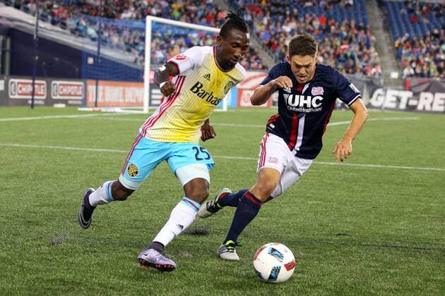 July 9, 2016; Foxborough, MA, USA; Columbus Crew defender Harrison Afful (25) and New England Revolution midfielder Kelyn Rowe (11) in action during the first half of an MLS Fussball Herren USA game between the New England Revolution and Columbus Crew at Gillette Stadium. New England defeated Columbus 3-1. MLS 2016: Crew vs Revolution JUL 09 - ZUMAc04_