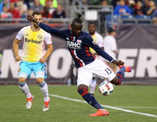 July 9, 2016; Foxborough, MA, USA; New England Revolution forward Kei Kamara (13) kicks the ball during the first half of an MLS Fussball Herren USA game between the New England Revolution and Columbus Crew at Gillette Stadium. New England defeated Columbus 3-1. MLS 2016: Crew vs Revolution JUL 09 - ZUMAc04_