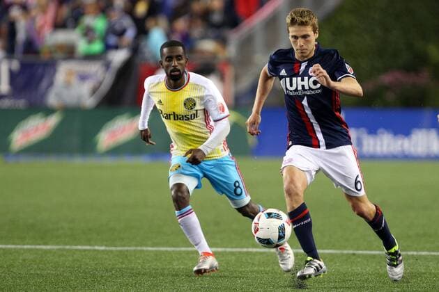 July 9, 2016; Foxborough, MA, USA; Columbus Crew midfielder Mohammed Saeid (8) and New England Revolution midfielder Scott Caldwell (6) in action during the second half of an MLS Fussball Herren USA game between the New England Revolution and Columbus Crew at Gillette Stadium. New England defeated Columbus 3-1. MLS 2016: Crew vs Revolution JUL 09 - ZUMAc04_