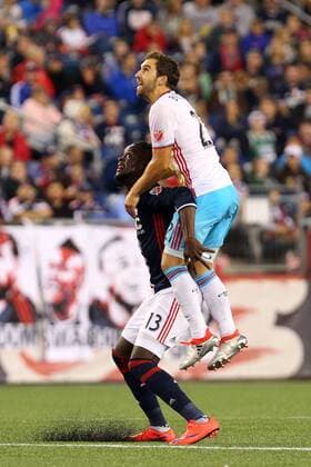 July 9, 2016; Foxborough, MA, USA; Columbus Crew defender Chad Barson (21) rides the back of New England Revolution forward Kei Kamara (13) during the second half of an MLS Fussball Herren USA game between the New England Revolution and Columbus Crew at Gillette Stadium. New England defeated Columbus 3-1. MLS 2016: Crew vs Revolution JUL 09 - ZUMAc04_