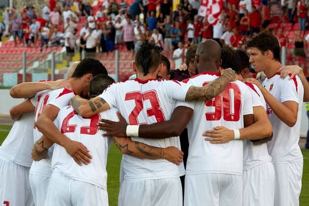12 07 2016 Hibernians Stadium, Paola, Malta UEFA Champions League Second Qualifying Round, First Leg Valletta FC v Red Star Belgrade 1-2 Valletta FC players unite as a show of force prior to the UEFA Champions League, second qualifying round, first leg match at the Hibernians Stadium in Paola, Malta against Red Star Belgrade of Serbia. Valletta FC v Red Star Belgrade - UEFA Champions League 2016 17 VALL_RSB_16