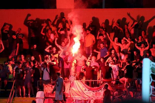 12 07 2016 Hibernians Stadium, Paola, Malta UEFA Champions League Second Qualifying Round, First Leg Valletta FC v Red Star Belgrade 1-2 The notorious Red Star Belgrade (Crvena zvezda) supporters light a flare during the UEFA Champions League, second qualifying round, first leg match at the Hibernians Stadium in Paola, Malta against Valletta FC. Valletta FC v Red Star Belgrade - UEFA Champions League 2016 17 VALL_RSB_16