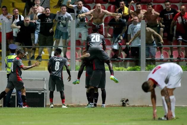 12 07 2016 Hibernians Stadium, Paola, Malta UEFA Champions League Second Qualifying Round, First Leg Valletta FC v Red Star Belgrade 1-2 Red Star Belgrade (Crvena zvezda) players celebrate in front of their team s supporters after scoring during the UEFA Champions League, second qualifying round, first leg match at the Hibernians Stadium in Paola, Malta against Valletta FC. Valletta FC v Red Star Belgrade - UEFA Champions League 2016 17 VALL_RSB_16