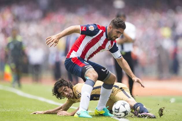 Sunday, July 17, 2016: Pumas Matias Britos, left, challenges Chivas Jair Pereira, during a Mexican soccer league match between Pumas UNAM and Chivas de Guadalajara held at Estadio OloÂ­mpico Universitario in Mexico City. Sports - July 17, 2016 - ZUMAc04_