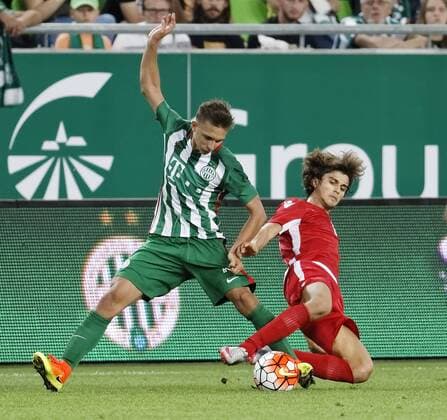 BUDAPEST, HUNGARY - JULY 20: Jurgen Bardhi (R) of FK Partizani slide tackles Dominik Nagy (L) of Ferencvarosi TC during the UEFA Champions League Qualifying Round match between Ferencvarosi TC and FK Partizani at Groupama Arena on July 20, 2016 in Budapest, Hungary. LaszloxSzirtesi 