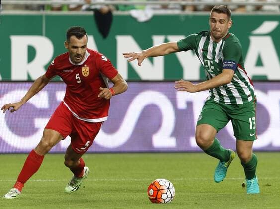 BUDAPEST, HUNGARY - JULY 20: Daniel Bode 13 of Ferencvarosi TC runs after the ball with Gezim Krasniqi 5 of FK Partizani during the UEFA Champions League Qualifying Round match between Ferencvarosi TC and FK Partizani at Groupama Arena on July 20, 2016 in Budapest, Hungary. LaszloxSzirtesi 