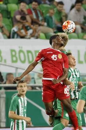 BUDAPEST, HUNGARY - JULY 20: Dominik Nagy (R) of Ferencvarosi TC battles for the ball in the air with Caleb Ekuban 45 of FK Partizani in front of Emir Dilaver (L) of Ferencvarosi TC during the UEFA Champions League Qualifying Round match between Ferencvarosi TC and FK Partizani at Groupama Arena on July 20, 2016 in Budapest, Hungary. LaszloxSzirtesi 