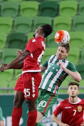 BUDAPEST, HUNGARY - JULY 20: Zoltan Gera 20 of Ferencvarosi TC battles for the ball in the air with Caleb Ekuban 45 of FK Partizan in front of Realdo Fili of FK Partizani during the UEFA Champions League Qualifying Round match between Ferencvarosi TC and FK Partizani at Groupama Arena on July 20, 2016 in Budapest, Hungary. LaszloxSzirtesi 