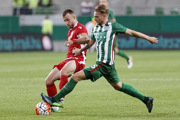 BUDAPEST, HUNGARY - JULY 20: Florian Trinks (R) of Ferencvarosi TC fights for the ball with Lorenc Trashi (L) of FK Partizani during the UEFA Champions League Qualifying Round match between Ferencvarosi TC and FK Partizani at Groupama Arena on July 20, 2016 in Budapest, Hungary. LaszloxSzirtesi 
