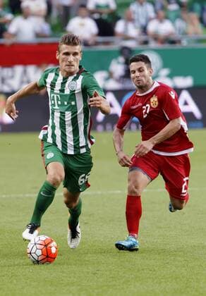 BUDAPEST, HUNGARY - JULY 20: Emir Dilaver (L) of Ferencvarosi TC leaves Agustin Torassa (R) of FK Partizani behind during the UEFA Champions League Qualifying Round match between Ferencvarosi TC and FK Partizani at Groupama Arena on July 20, 2016 in Budapest, Hungary. LaszloxSzirtesi 