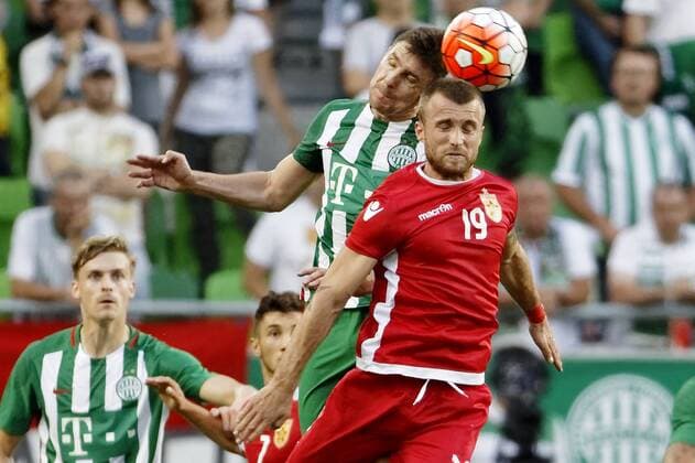 BUDAPEST, HUNGARY - JULY 20: Zoltan Gera (L) of Ferencvarosi TC battles for the ball in the air with Lorenc Trashi 19 of FK Partizani during the UEFA Champions League Qualifying Round match between Ferencvarosi TC and FK Partizani at Groupama Arena on July 20, 2016 in Budapest, Hungary. LaszloxSzirtesi 