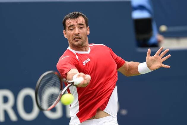 July 25, 2016: Ivan Dodig of Croatia returns the ball to Borna Coric of Croatia during their first round match of the Rogers Cup tournament at the Aviva Centre in Toronto, Ontario, Canada on July 25, 2016. Cal Media TENNIS 2016 - Rogers Cup Toronto July 25 - ZUMAc04_