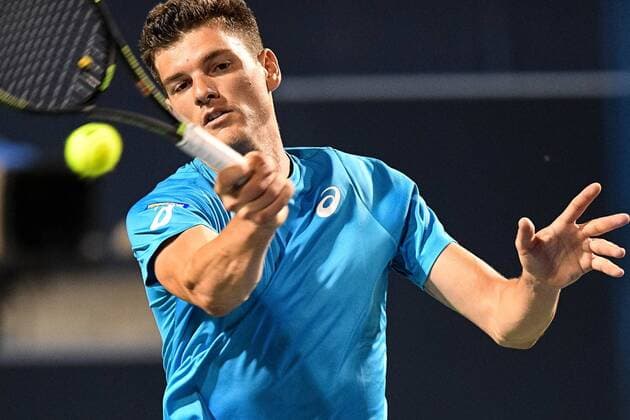 July 25, 2016: Frank Dancevic of Canada returns the ball to Sam Querrey of the United States during their first round match of the Rogers Cup tournament at the Aviva Centre in Toronto, Ontario, Canada on July 25, 2016. Cal Media TENNIS 2016 - Rogers Cup Toronto July 25 - ZUMAc04_