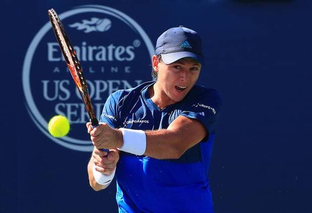(160726) -- TORONTO, July 26, 2016 -- Alejandro Gonzalez of Colombia returns the ball against Bernard Tomic of Australia during their first round of men s singles match at the 2016 Rogers Cup in Toronto, Canada, July 25, 2016. Alejandro Gonzalez lost 0-2. )(hcs) (SP)CANADA-TORONTO-TENNIS-ROGERS CUP-MEN S SINGLES ZouxZheng 